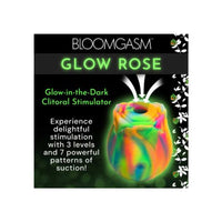 Glow-in-the-dark clitoral stimulator packaging with colorful design and text on a black background.