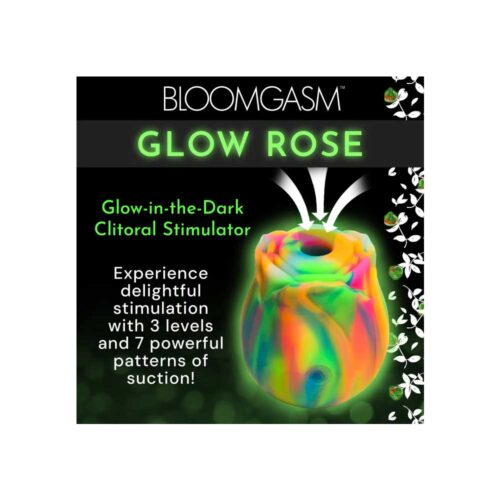 Glow-in-the-dark clitoral stimulator packaging with colorful design and text on a black background.