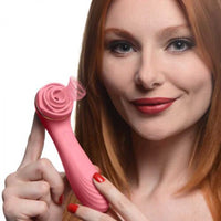 Woman holding a pink passion petals vibrator with a white background