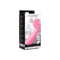 Pink vibrator with packaging on a white background