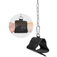 black wrist cuff suspended by silver chain next to picture of wrist in the cuff