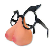 Novelty glasses with a boobies nose and black cat-eye frames on a white background