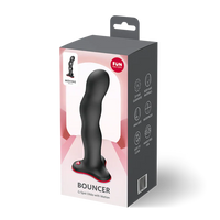 Package of a G-Spot dildó with motion on a white background