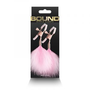 black box with picture of nipple clamps with pink feathers