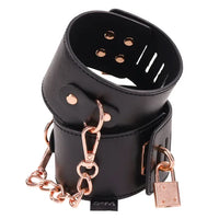black leather like locking hand cuffs with gold lock and chain