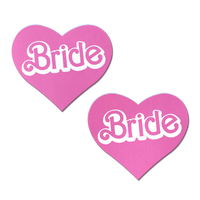 heart shaped pasties with bride written in center in white and pink letters