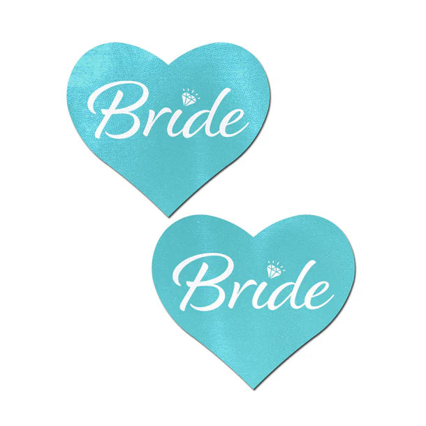 blue heart shaped pasties with bride written in whit with diamond on top of the I