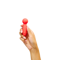 Hand holding a red handheld massager against a white background