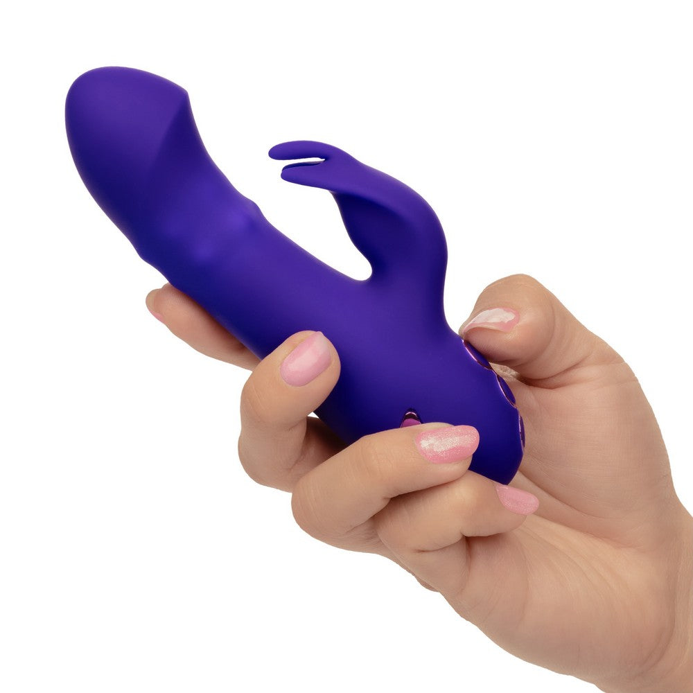 purple vibrator with beads and stimulator held in hand