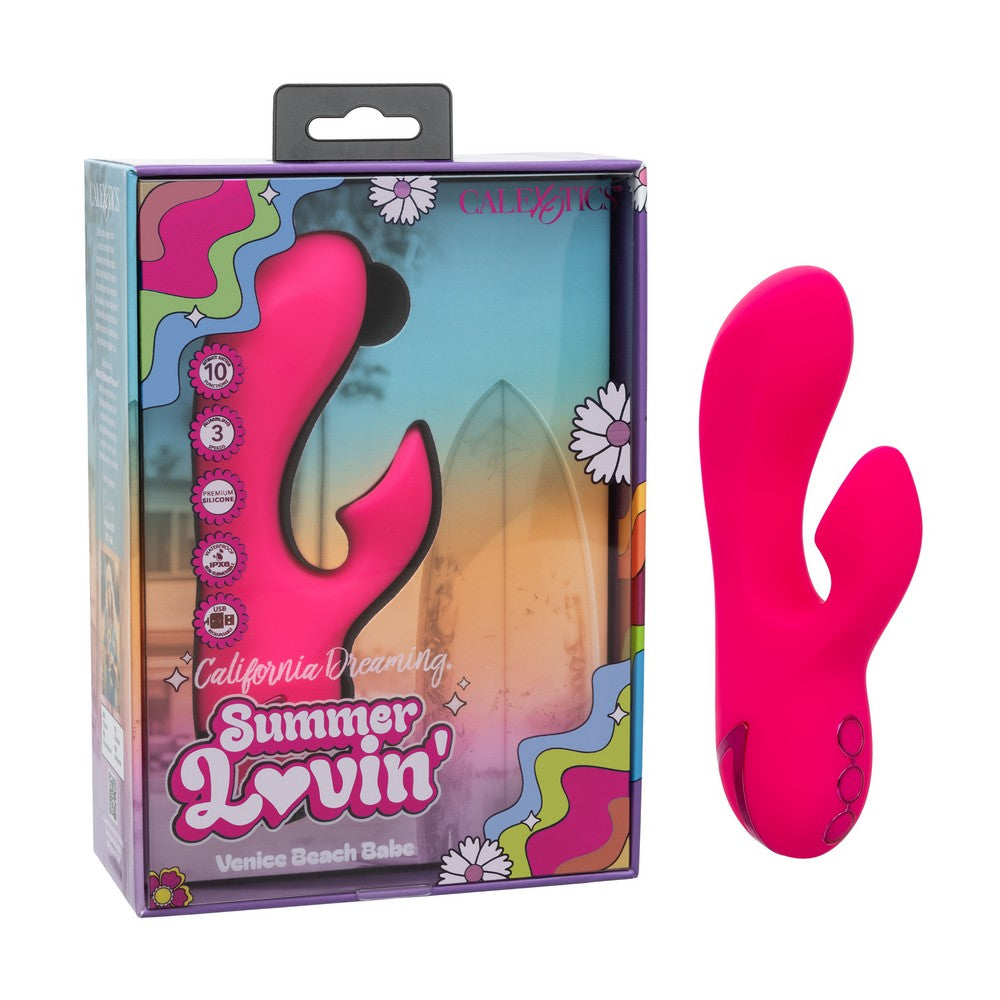 A bright pink silicone personal massager shown next to its retail packaging box. The box features a colorful retro design with the text 'California Dreaming Summer Lovin'' and 'Venice Beach Bake'.