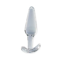 A clear glass butt plug with a smooth, tapered tip and a curved base, shown on a solid white background.