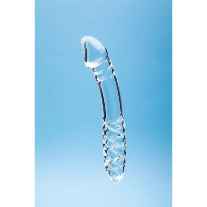 A transparent glass dildo with a textured handle, shown vertically against a light blue gradient background.