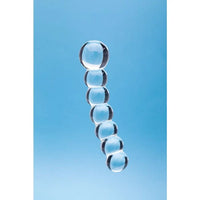 A clear glass or acrylic segmented rod or stand made of seven stacked transparent spheres, shown against a solid light blue background.
