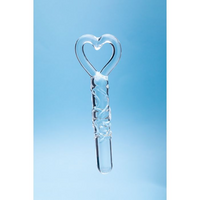 glass dildo with heart at the top as a finger ring holder