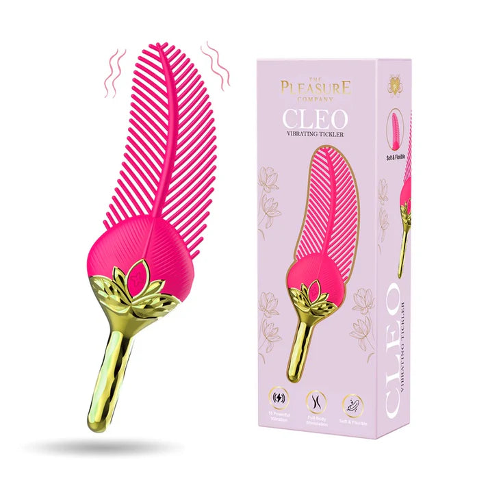 Pink and gold comb-like device with packaging on a white background