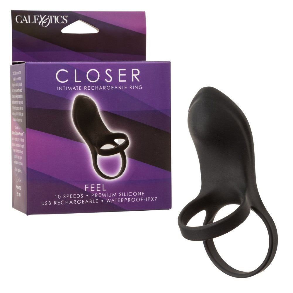 black vibrating cock ring with ball strap and stubby clitoral stimulator beside box packaging