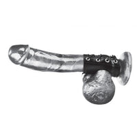 Erect penis with a black sheath that goes around the base of the penis, has a hole for the balls, and then circles around the base of the shaft of the penis. Sheath is a black leather like material with silver holes for the tightening string 