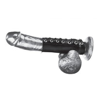 Erect penis with a black sheath that goes around the base of the penis, has a hole for the balls, and then circles around the base of the shaft of the penis. Sheath is a black leather like material with silver holes for the tightening string