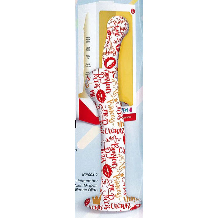 a white dildo with a red & yellow princess theme pattern and a suction cup base, shown next to its box packaging