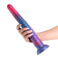 pink multi colored long dildo held in hand