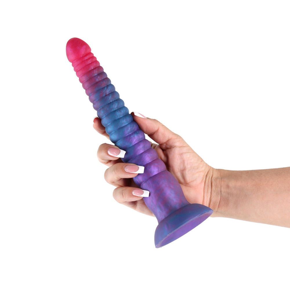 pink & purple dildo held in hand