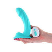 Purple packaging of a 5-inch vibrating dildo with 'Colours Curve'  held in a hand with a white background