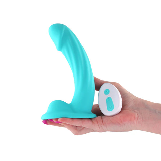 Purple packaging of a 5-inch vibrating dildo with 'Colours Curve'  held in a hand with a white background