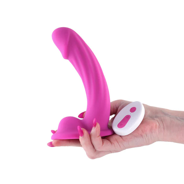Package of a 6-inch vibrating dildo with 'Colours Curve' held by a hand with a white background