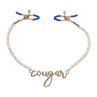 gold chain with the word cougar in the middle with blue nipple clamps