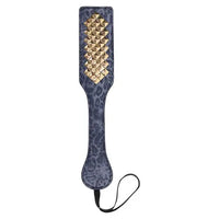 grey paddle with gold studs in center 