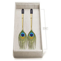 nipple tweezers with peacock feathers in box with measurements