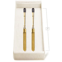 nipple tweezers with gold tassels in box with measurements
