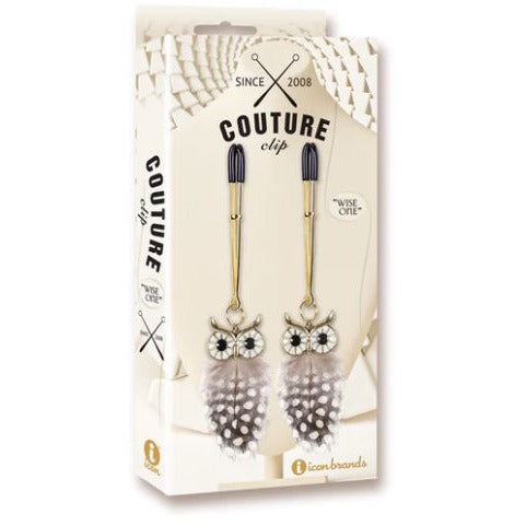beige box with picture of nipple tweezers and feathered owl
