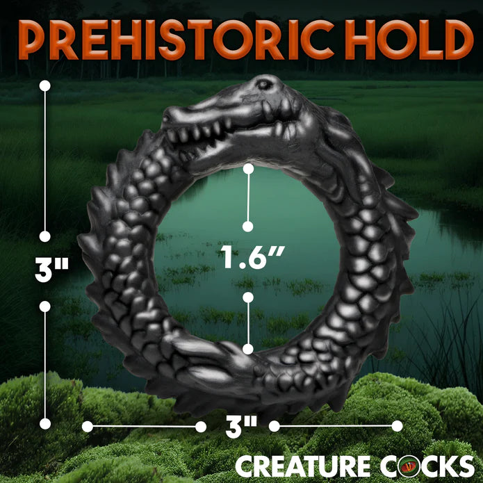 black reptile cock ring with swamp back ground