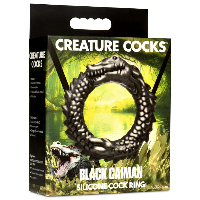 black circle cock ring reptile looking with swamp back ground