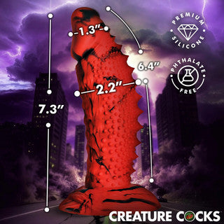 Creature Cocks Gojira silicone dildo displayed with product dimensions showing 7.3-inch total length, 6.4-inch insertable length, 2.2-inch width, and 1.3-inch tip diameter, alongside icons for premium silicone and phthalate-free materials.