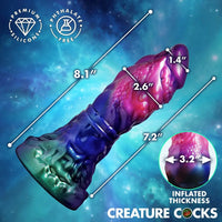 Silicone product with measurements on a space-themed background, featuring the brand 'Creature Cocks'.