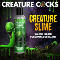 bottle of creature slime water based lubricant with green creature