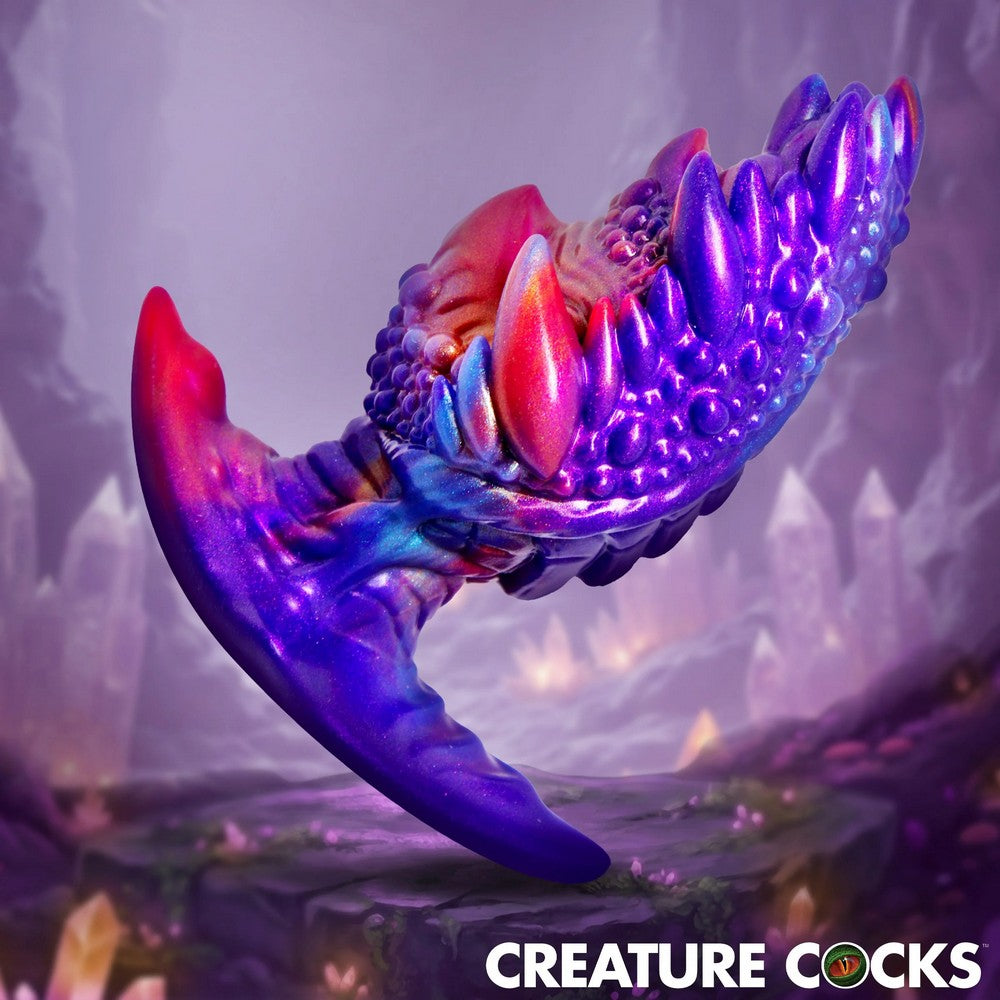 Colorful, futuristic-looking claw or wing against a mystical background with 'Creature Cocks' branding.