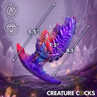 Colorful silicone volkron anal plug with measurements and 'Creature Cocks' branding on a fantasy landscape background.