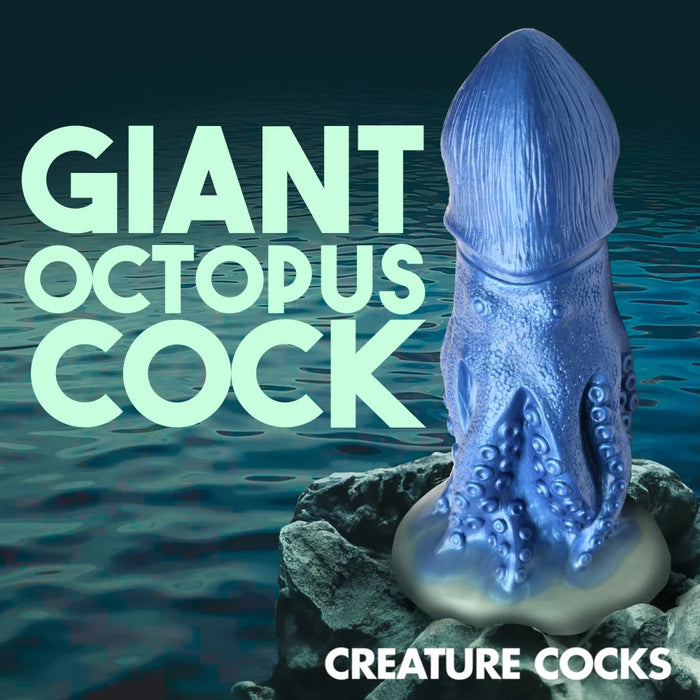 blue octopus dildo in front of water