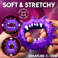 Creature Cocks Constrictor Silicone Cock Ring by XR featuring a purple monster-inspired design with fang and spike details, soft stretchy premium silicone, a 1.1" unstretched inner diameter, and 3.2" overall height