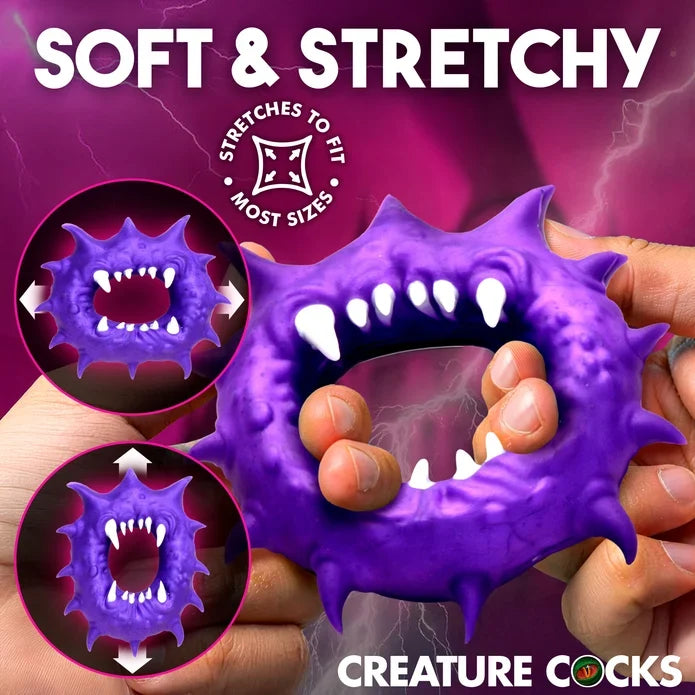 Creature Cocks Constrictor Silicone Cock Ring by XR featuring a purple monster-inspired design with fang and spike details, soft stretchy premium silicone, a 1.1" unstretched inner diameter, and 3.2" overall height