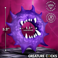 Creature Cocks Constrictor Silicone Cock Ring by XR featuring a purple monster-inspired design with fang and spike details, soft stretchy premium silicone, a 1.1" unstretched inner diameter, and 3.2" overall height
