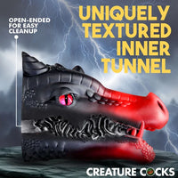 Creature Cocks Drago Silicone Masturbator shown in profile with its open-ended design and uniquely textured inner tunnel. The cutaway view highlights the sculpted internal ridges, while the open back is designed to make rinsing and cleanup easier.