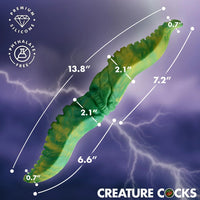Green silicone product with measurements on a purple lightning background, featuring the brand 'Creature Cocks'.
