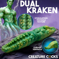 Green tentacle-like product with detailed texture, labeled 'Dual Kraken' by Creature Cocks, on a purple background.