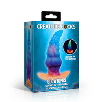 Box of Glowtopus glow-in-the-dark silicone anal plug by Creature Cocks on a white background