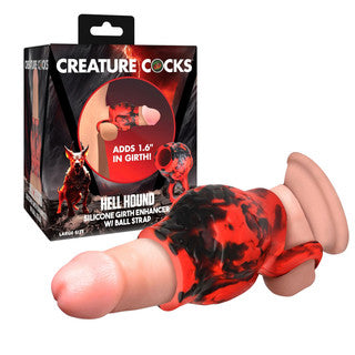 Silicone product with red and black design in front of 'Creature Cocks' packaging.