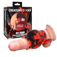 Silicone girth enhancer with red and black design next to its packaging labeled 'Creature Cocks'.